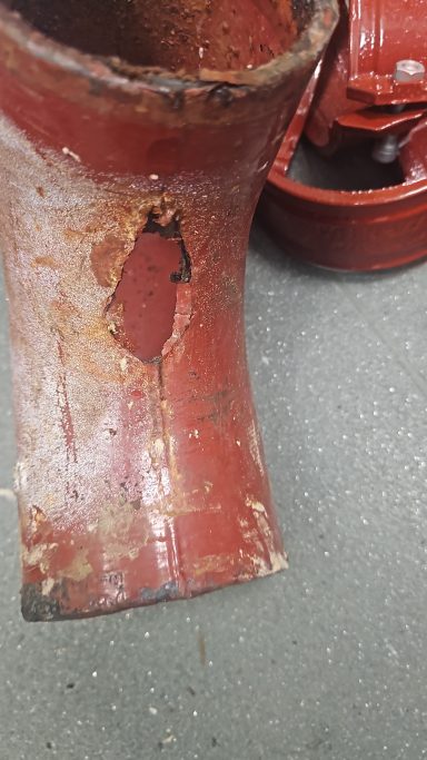 100mm Ensign pipe with hole due to boiler condensate. Why it's not wise to discharge untreated boiler condensate into cast iron pipework.